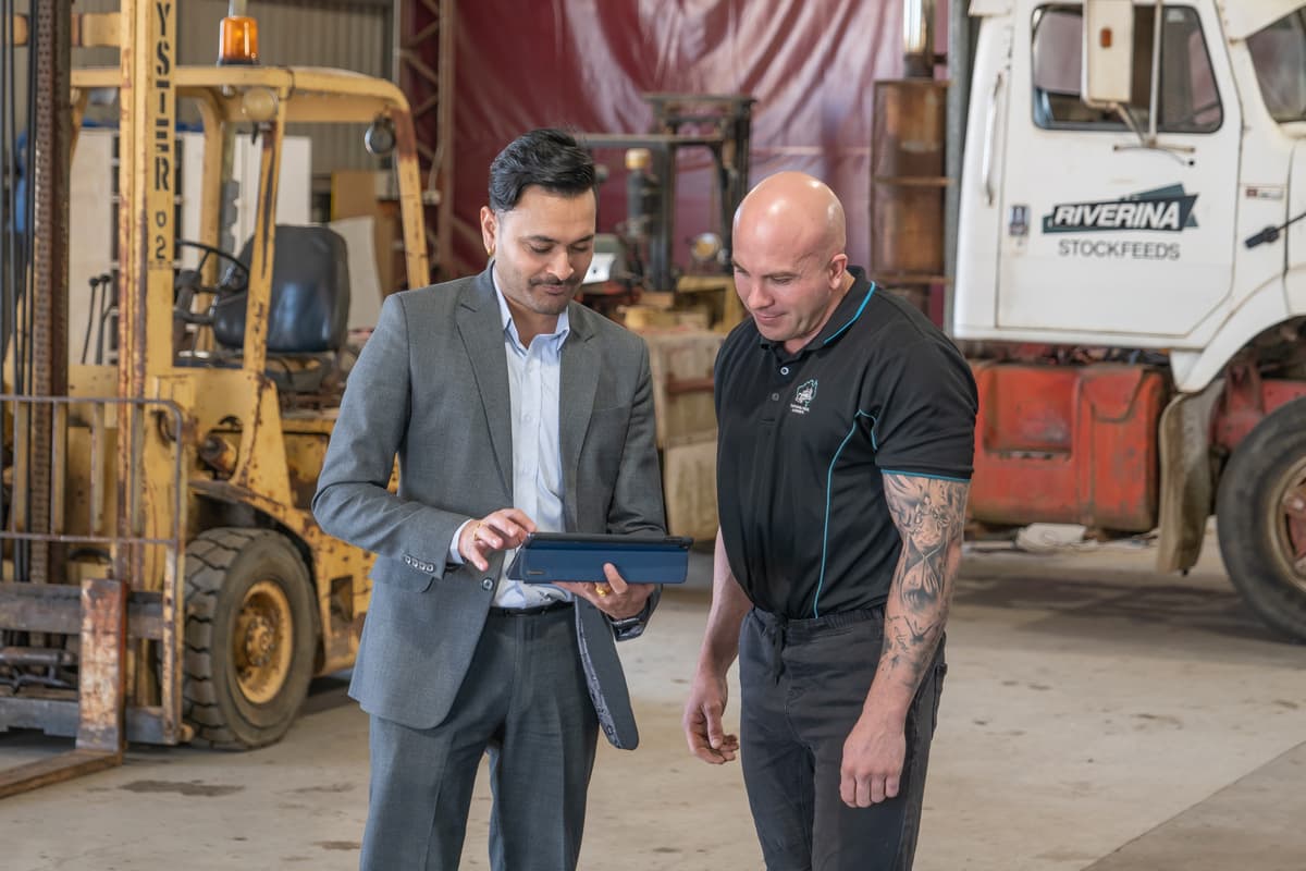 The GRIVITY team discussing digital marketing results with a client in a professional setting.